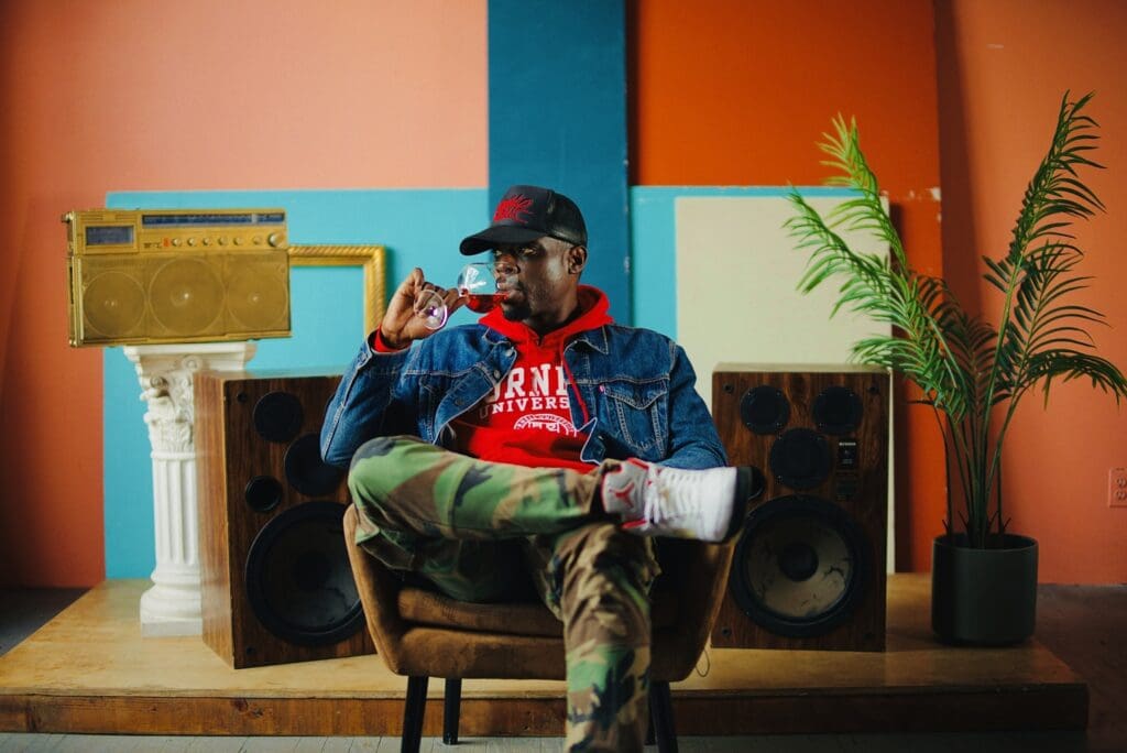 Jermaine Stone Sitting Sipping Wine
